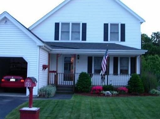 Front View in late Spring - Beautiful Lawn and Flower Bed