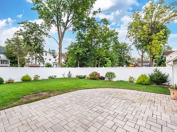Large Paver Patio with privacy fence.