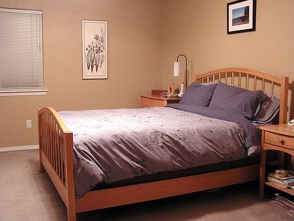 large master bedroom with his & her closets