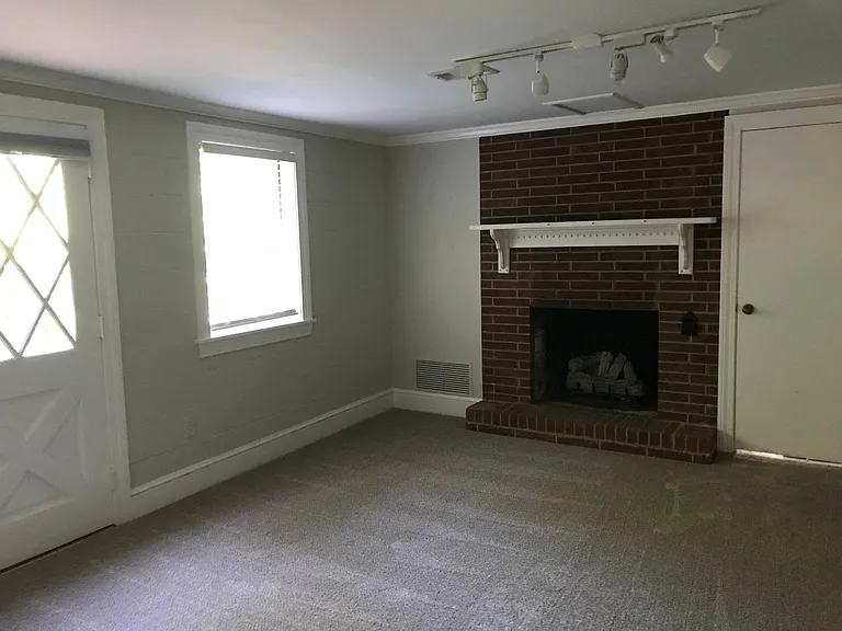Large rec room downstairs with new carpet.