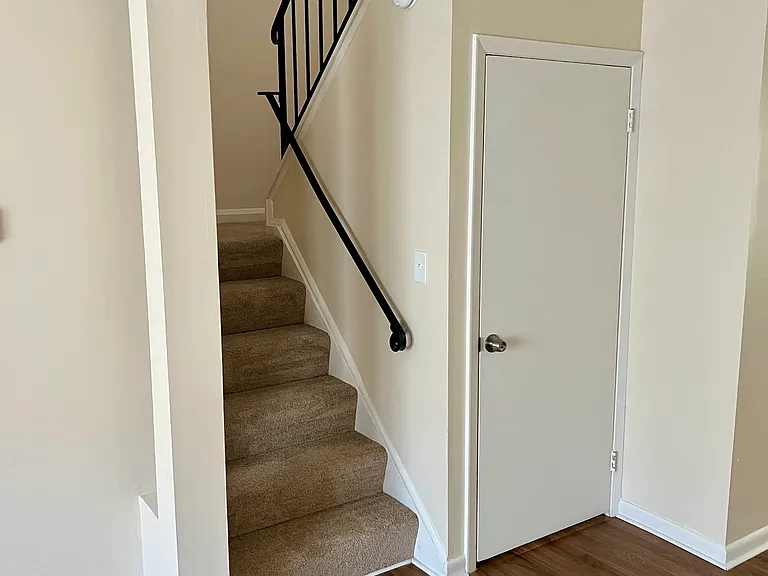 Stairs to second floor and basement