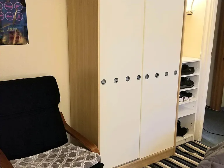 Ivory Room - Lounge Chair, Coat hooks, Armoire, Shoe Rack, Lamp & Shelf.