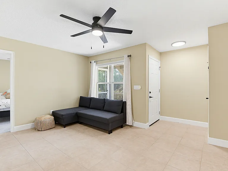 Living room with furniture, entarnce door