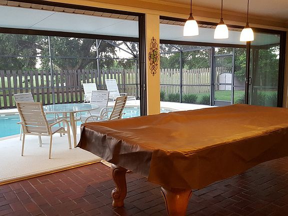 Large Florida room with wide sliders