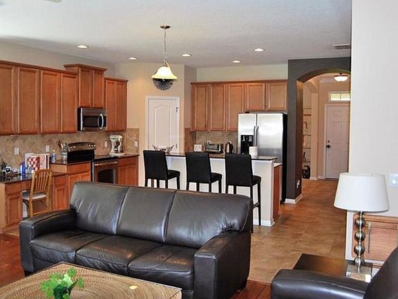 great room into kitchen (as previously furnished)