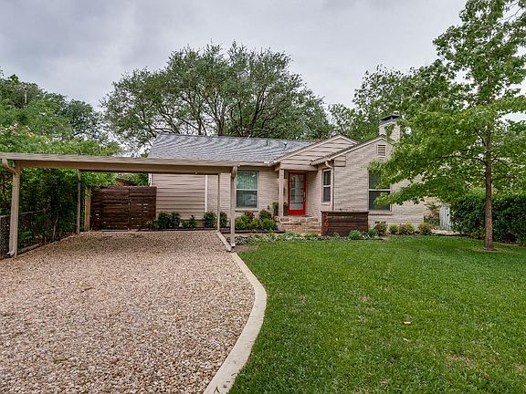 Gravel drive to carport and entrance