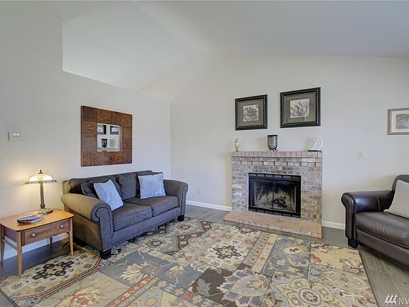 The main floor features vaulted ceilings and plenty of natural light streaming in. 