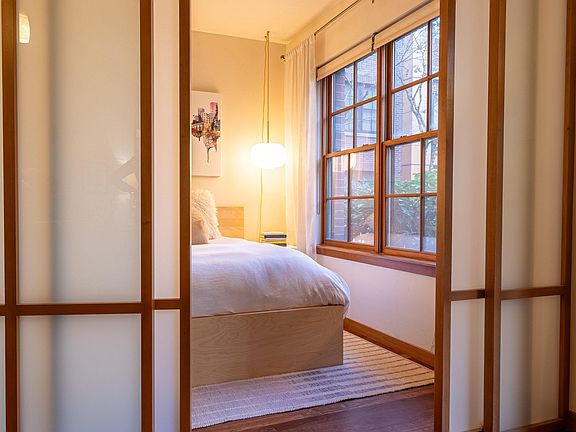 Bedroom with Japanese sliding wall system for privacy.