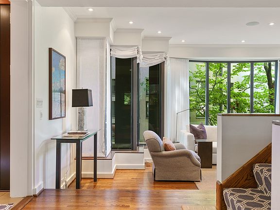The front door opens into a deep hued vestibule that leads to the foyer.  The space separates the li