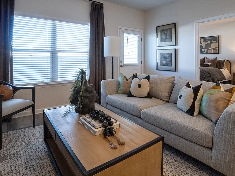 Living room with large window letting in a ton of natural light.