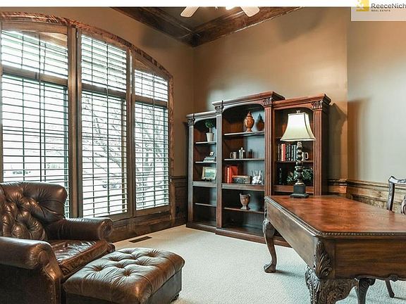 Pretty Study w/triple window, plantation shutters, new carpeting and deep crown molding/wainscoting.