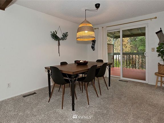 Dining room open to living room for a open feel. Right off the kitchen.