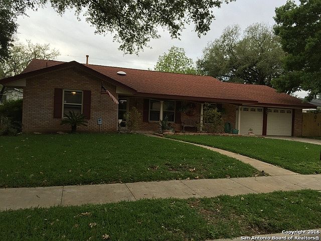 Front of home has long covered porch