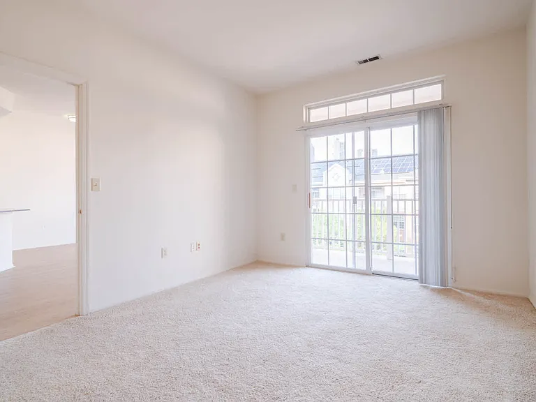 Carpeted Bedroom with Balcony