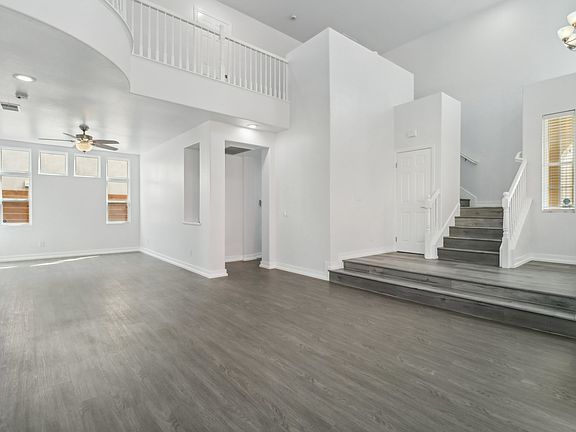 Living room looking to formal dining room and stairs