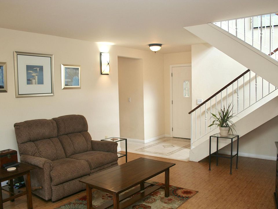Front entryway, living room, stairs leading to 2nd floor.