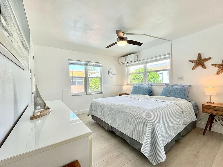 king size bed with dresser and two nightstands