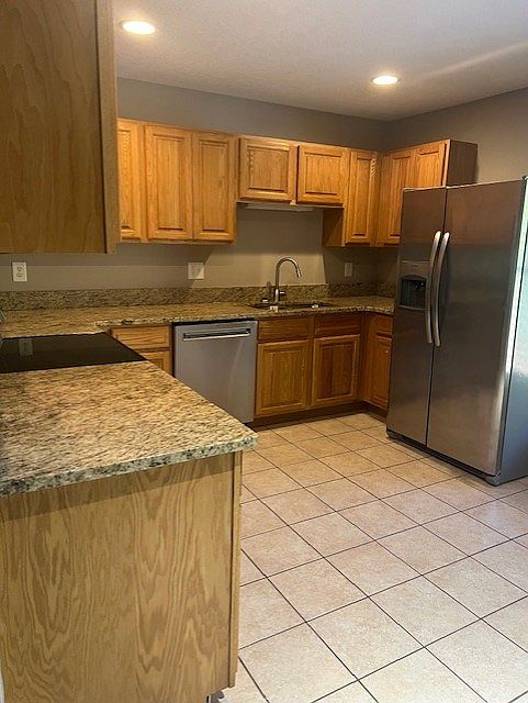 Kitchen feautres granite counters and stainless steel appliances