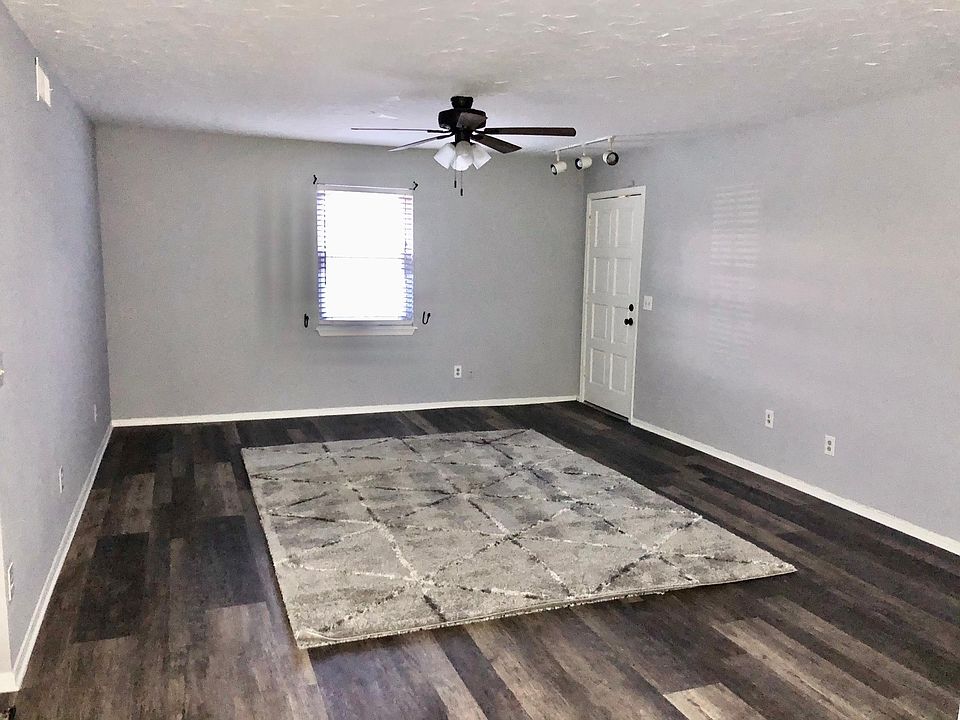 Spacious living room with a faux wood flooring, rug and freshly painted walls & ceilings. Plenty of electrical, cable and telephone outlets. Room size - 18.5 x 14.5.