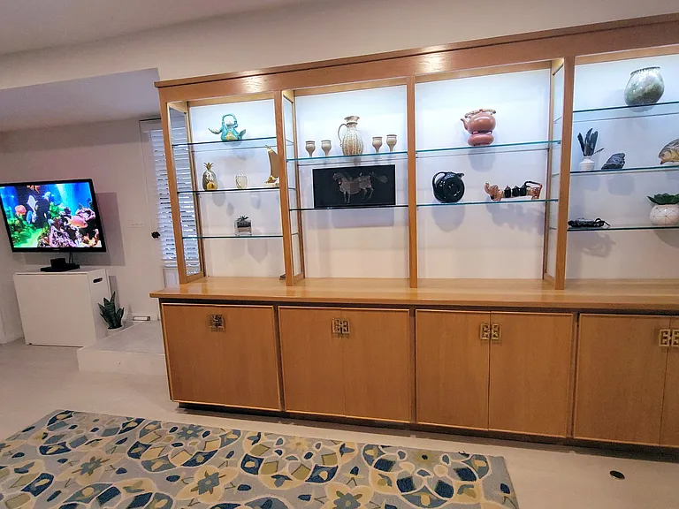 Additional storage in custom cabinetry.