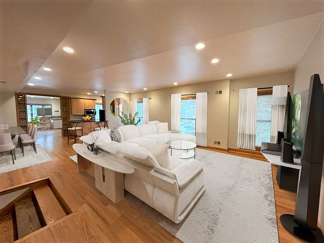 Massive living space with fantastic natural light (Floor to ceiling windows) Hardwood floors throughout.