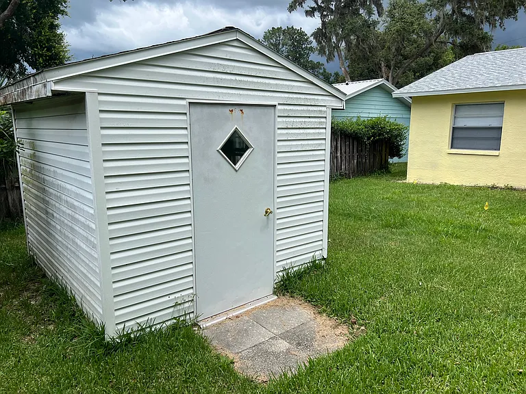 Storage shed with workbench.