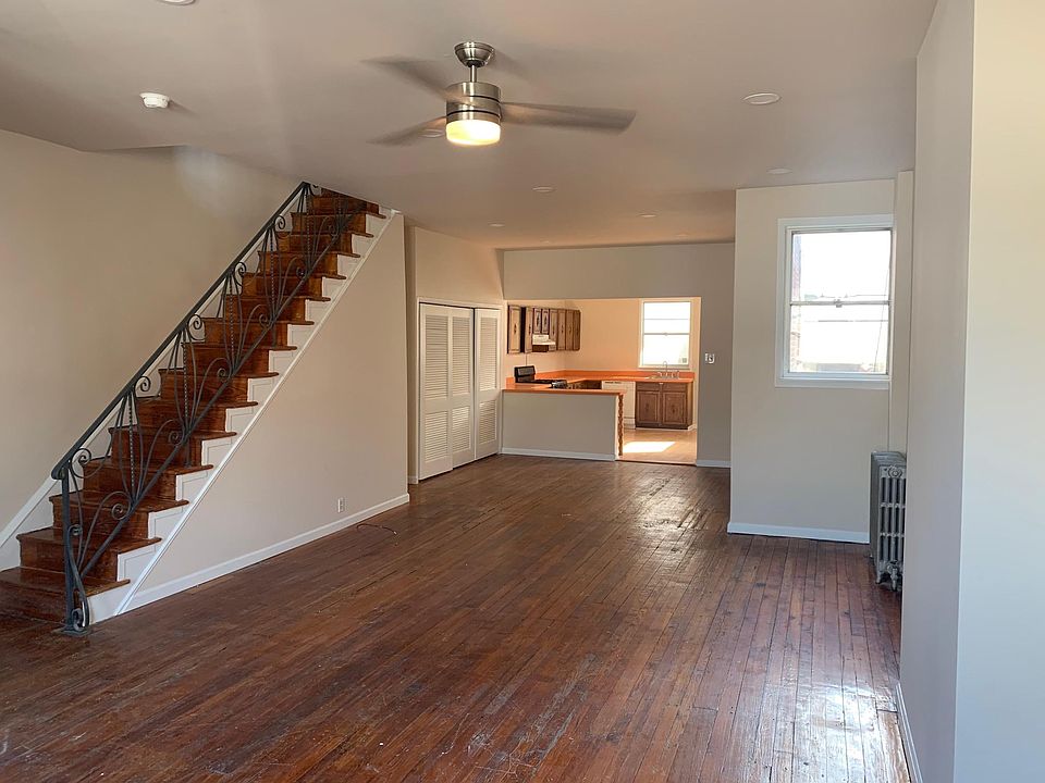 Living room w/ recessed lights and contemporary new ceiling fan. All rooms freshly painted. Authentic Original Hardwood floors.