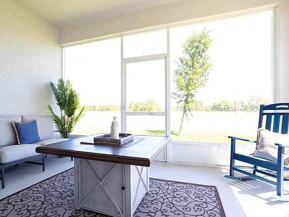 Your living space extends outdoors to a covered lanai - Shelby by Highland Homes