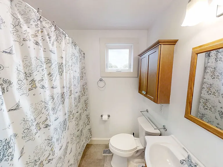 Second level full bath with tub/ shower combo.