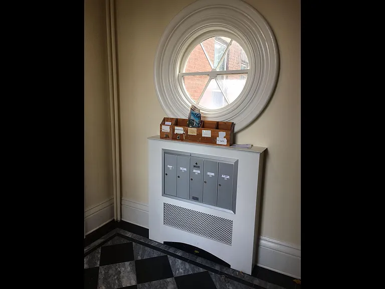 foyer of building with mailboxes (not the entrance to apartment 4)