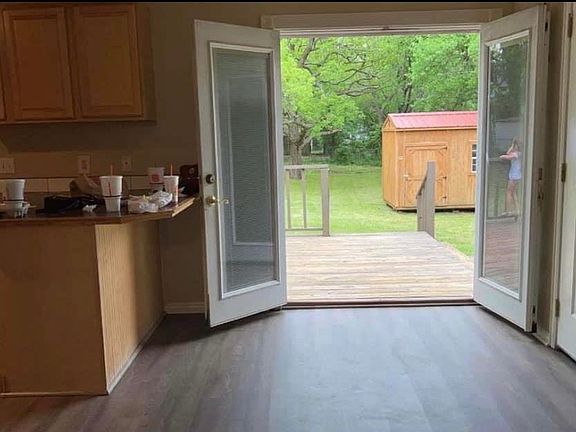 Dining room French doors to back deck and yard