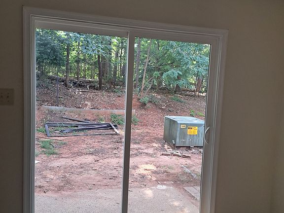 Freshly installed sliding glass door off Kitchen.