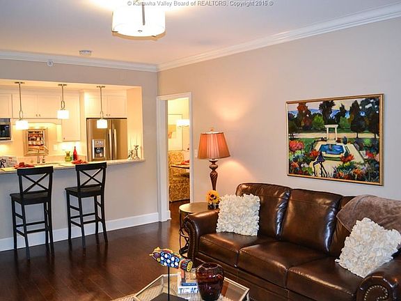 The renovated kitchen bar in the model unit really opens up the living space to create a wonderful feel!