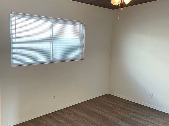 Bedroom with ceiling fan.