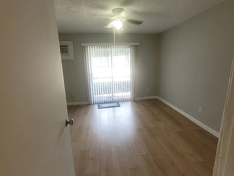 View of street-facing (left from the stairs) bedroom from upstairs landing