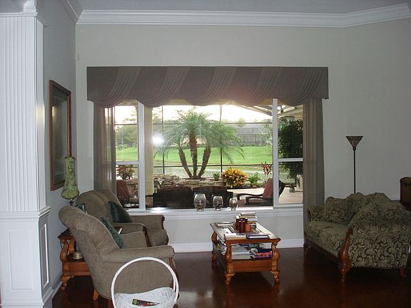 30 foot tall living area hand carved moulding all around