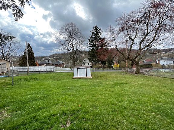 Nice private fenced yard with shed. Patio overlooks yard. Off Street Parking in rear and front of home