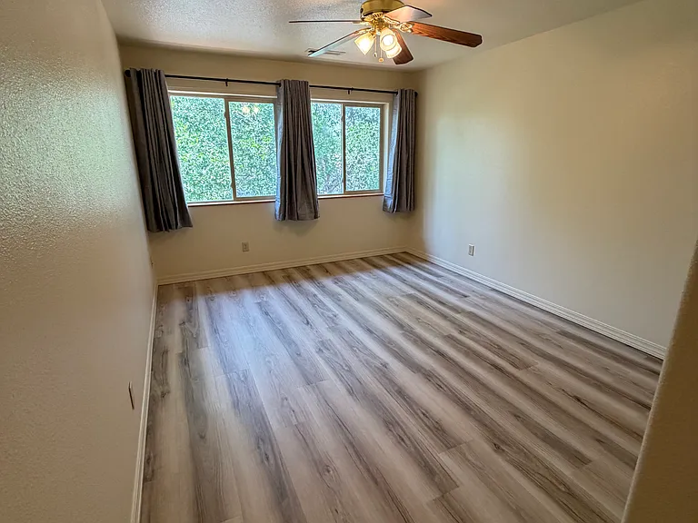 Master bedroom, with ceiling fan.