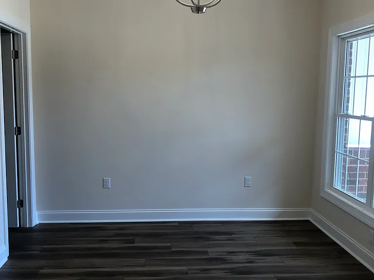 Dining room with lots of natural light and bonus room off to the left