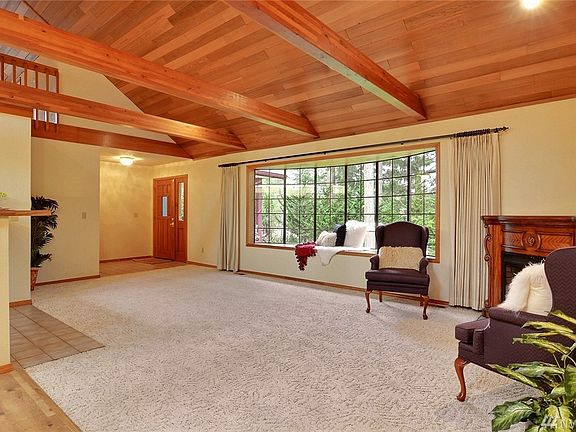 Here is the other side of the great room area with another view of the wood beams and gorgeous car decking ceiling.