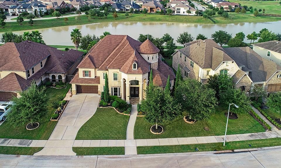 Welcome to this phenomenal, executive home in Cinco Ranch, Katy,Tx. The home is located on a waterfront lake lot. This home is full of design, high quality craftmanship, and offers a life of luxury!
