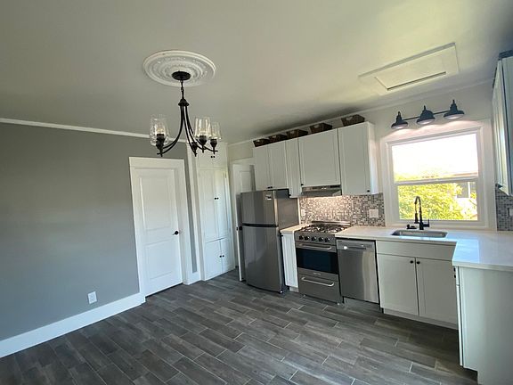 Open concept living room/dining/kitchen