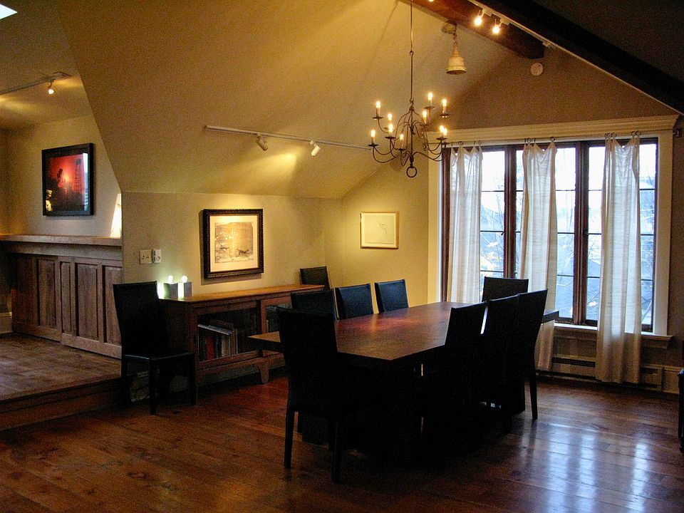 top floor loft living area dining room, paned floor to ceiling windows facing north