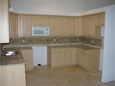 Granite counters and thumblestone backsplash