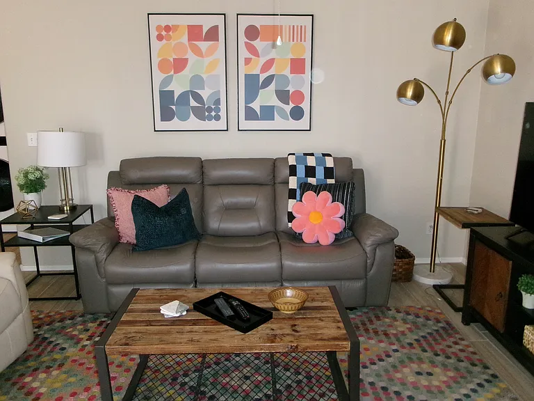 Large multi color rug on tile floor
