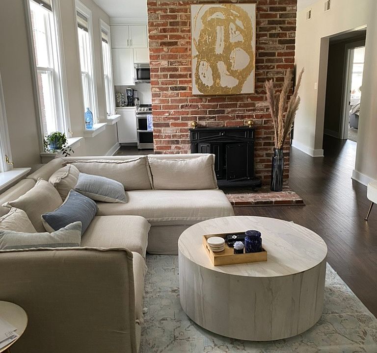 Gas log fireplace in living room/ open to dining and kitchen