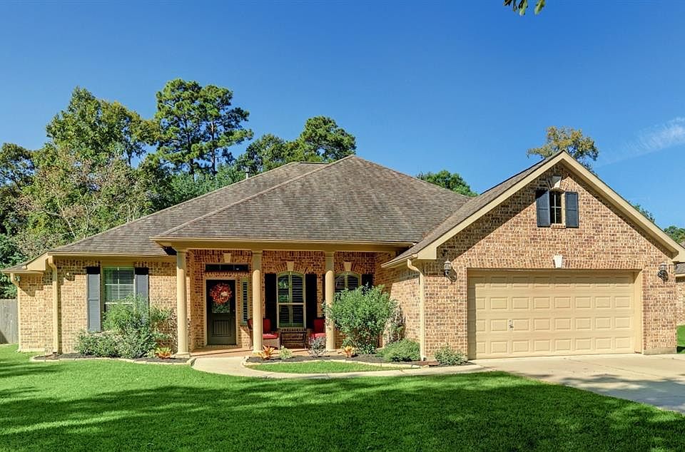 Country atmosphere with city conveniences. Charming entry with delightful covered front porch. Great curb appeal.