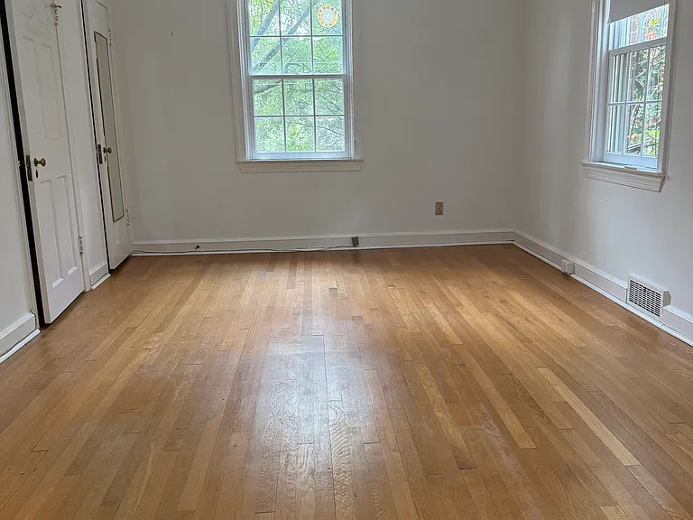 Large primary bedroom with two closets.