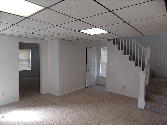 Living room with entry into the front family room.  Family room was used as a first floor master bedroom at one time.