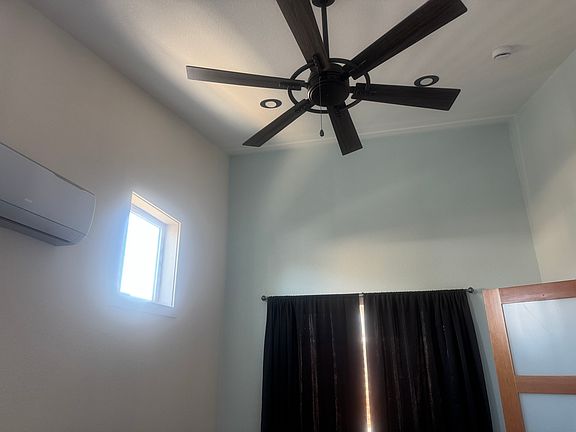 ceiling fans through out unit. A/C unit in bedroom